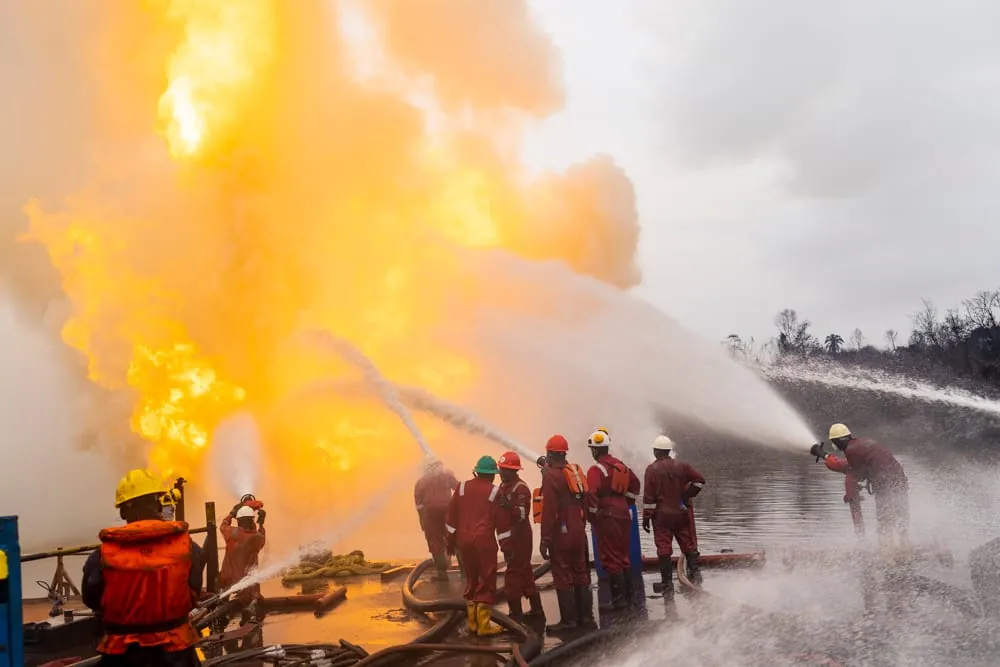 Crew fighting a well fire with water monitors